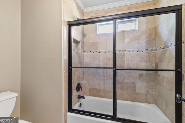 bathroom featuring toilet, enclosed tub / shower combo, and ornamental molding