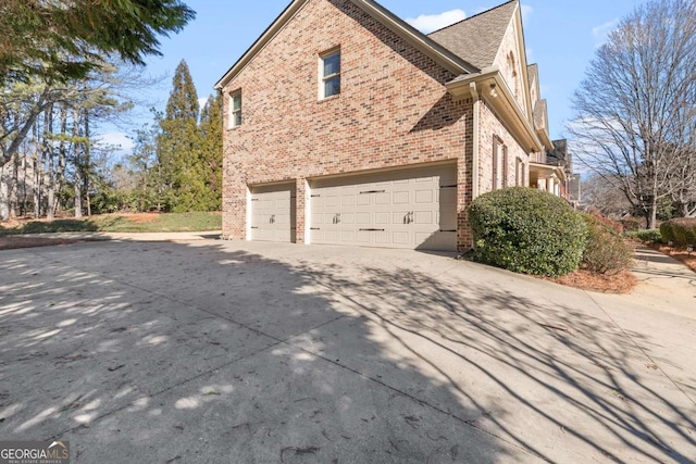 view of side of property featuring a garage