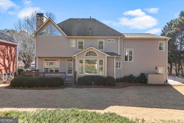 rear view of property with a deck