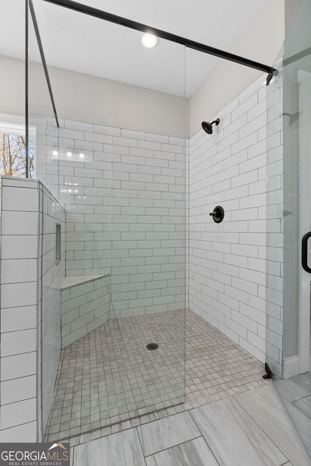 bathroom with a shower stall