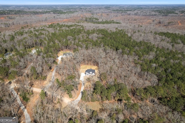 aerial view with a wooded view