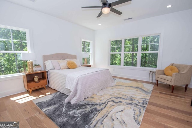 bedroom featuring ceiling fan and light hardwood / wood-style floors