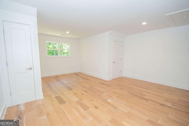 unfurnished room with light hardwood / wood-style flooring