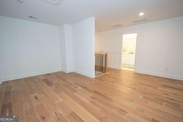 spare room with light wood-type flooring