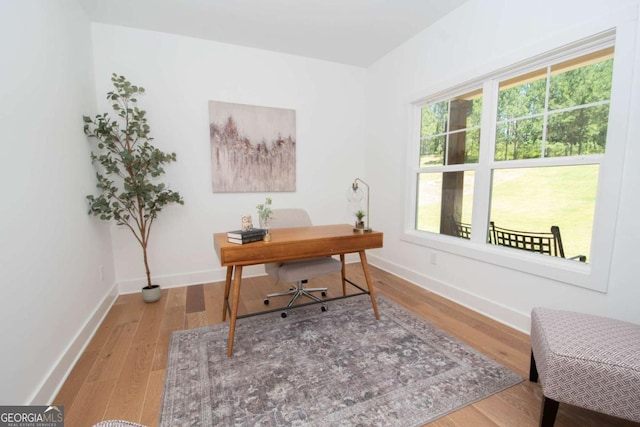 office area with hardwood / wood-style floors