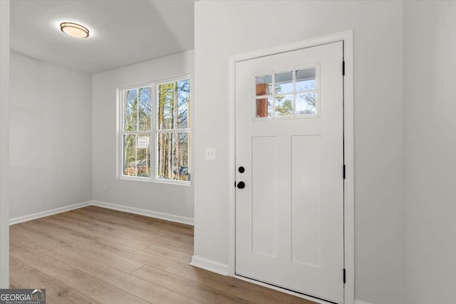 entrance foyer with light hardwood / wood-style flooring