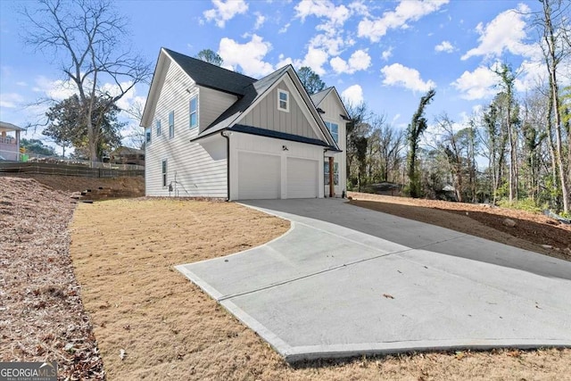 view of side of property with a garage