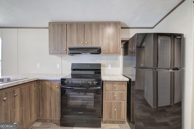 kitchen featuring black appliances, sink, and a textured ceiling