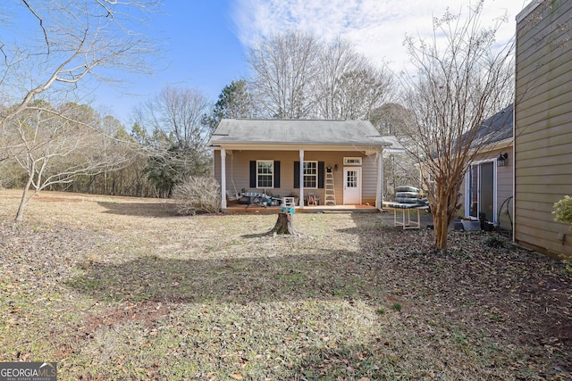 back of house featuring a porch