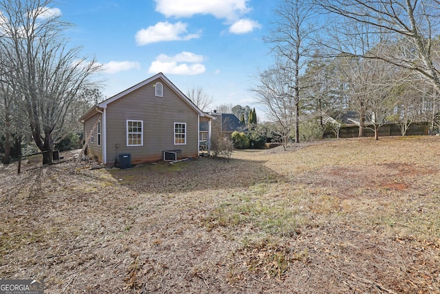 view of side of property with central AC unit