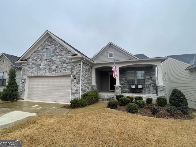 view of front of home with a garage and covered porch