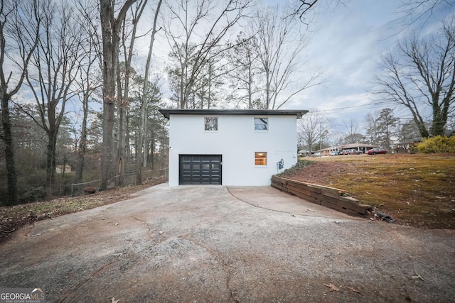 view of property exterior with a garage