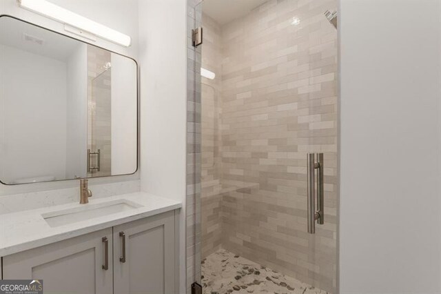 bathroom featuring vanity and walk in shower