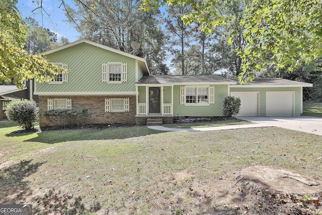 tri-level home featuring a front lawn and a garage