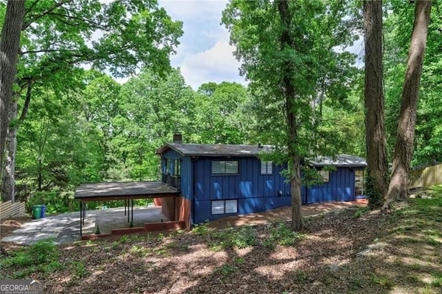 rear view of house with a carport