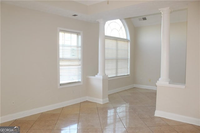 unfurnished room featuring light tile patterned flooring