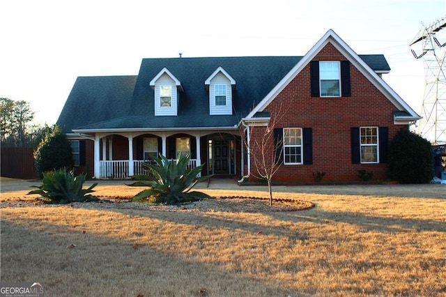 view of front of house with a front lawn and a porch