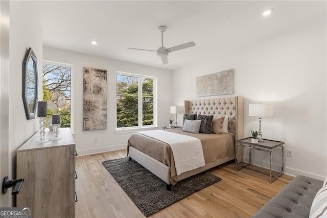 bedroom with light wood-type flooring and ceiling fan