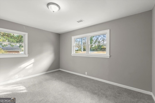 unfurnished room with carpet flooring