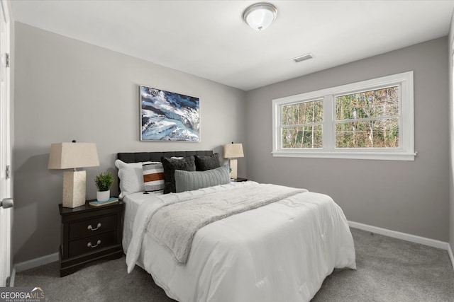 bedroom with light colored carpet