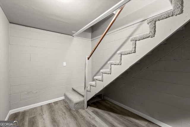 stairs with wood-type flooring