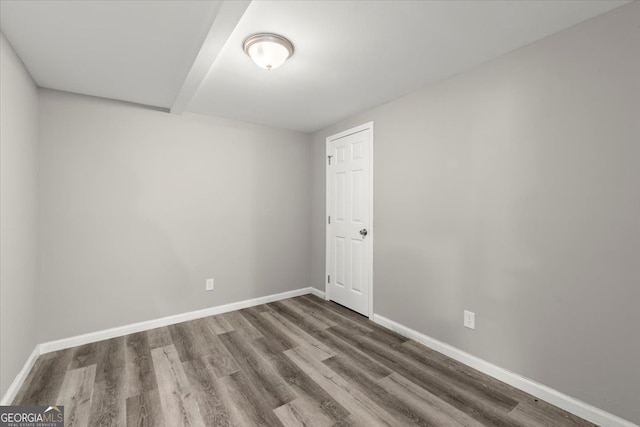 spare room featuring hardwood / wood-style flooring