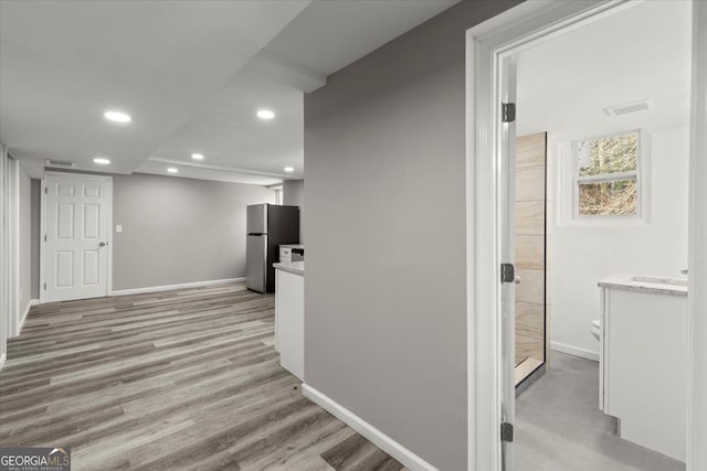 hallway featuring light hardwood / wood-style flooring