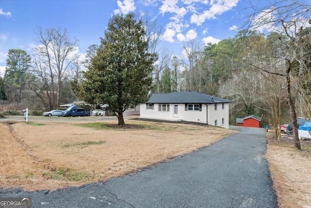 view of front of house with an outbuilding and a garage