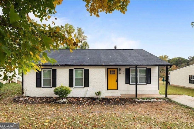 ranch-style house with a front lawn