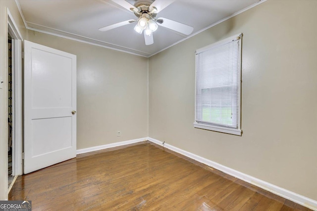 711 Stone Ave, Waynesboro, GA 30830 - spare room featuring ceiling fan, wood-type flooring, and crown molding