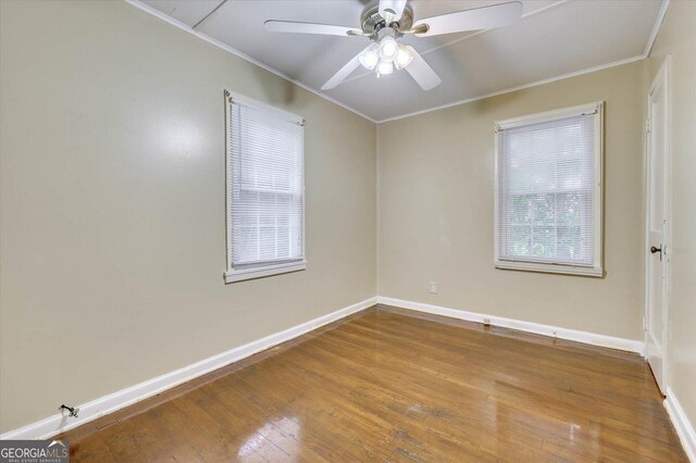 711 Stone Ave, Waynesboro, GA 30830 - spare room with hardwood / wood-style floors, ceiling fan, and ornamental molding