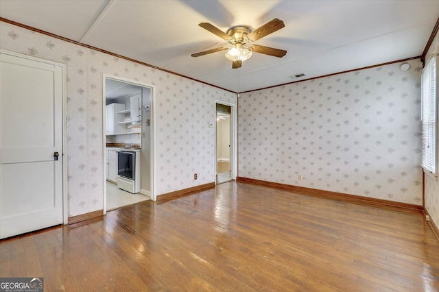 711 Stone Ave, Waynesboro, GA 30830 - interior space featuring ceiling fan, light hardwood / wood-style flooring, and ornamental molding
