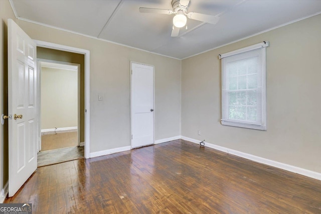 711 Stone Ave, Waynesboro, GA 30830 - unfurnished room featuring ceiling fan and dark wood-type flooring