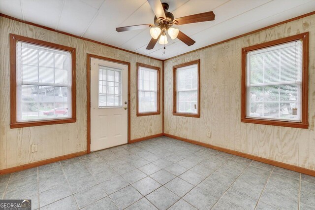 711 Stone Ave, Waynesboro, GA 30830 - tiled spare room with ceiling fan and crown molding