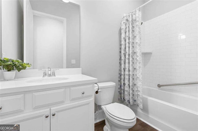 full bathroom with hardwood / wood-style flooring, vanity, toilet, and shower / bathtub combination with curtain