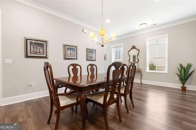 dining space with a chandelier, dark wood-type flooring, and crown molding