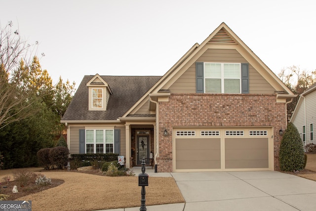 view of front of house featuring a garage, brick siding, driveway, and roof with shingles