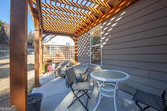 view of patio with a pergola and area for grilling