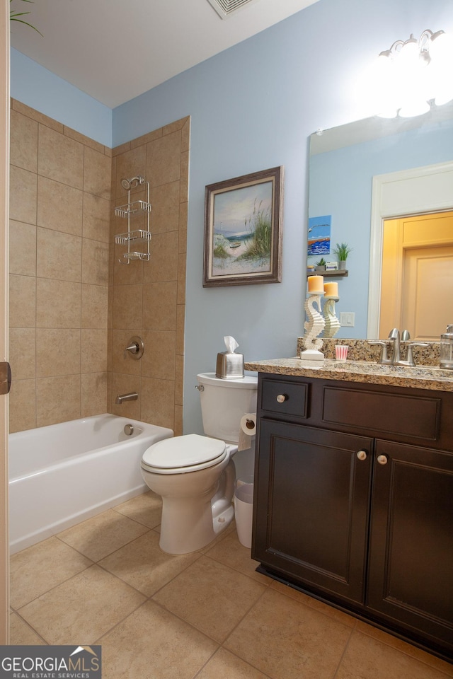 full bathroom with toilet, vanity, tile patterned floors, and tiled shower / bath