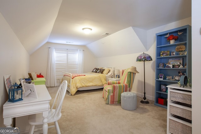 carpeted bedroom with lofted ceiling