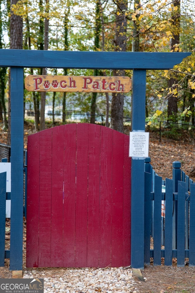 view of gate with fence