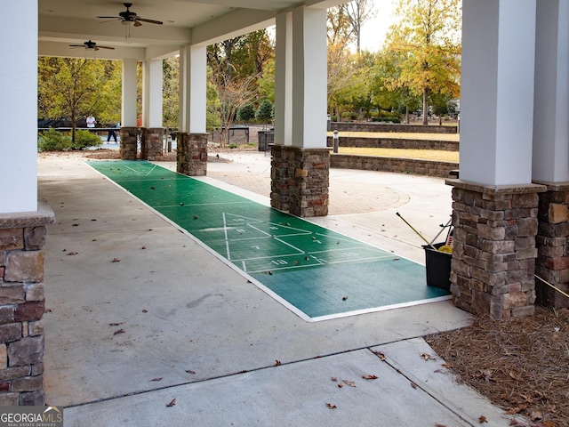 view of patio with shuffleboard and a ceiling fan