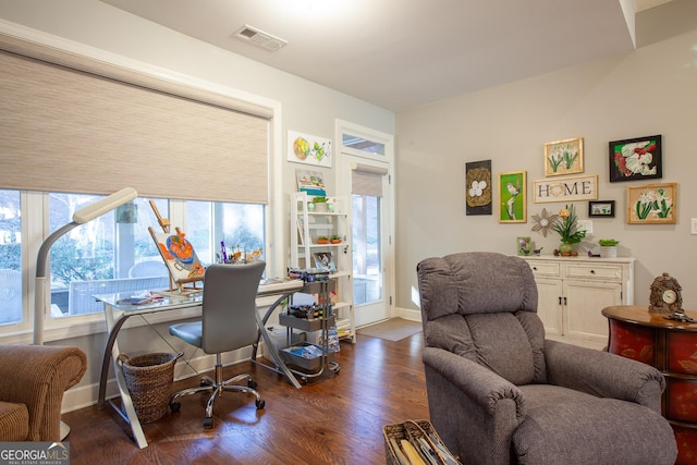 office with dark hardwood / wood-style flooring