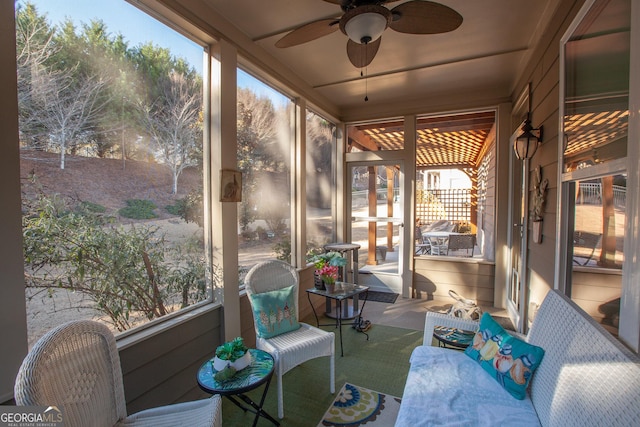 sunroom / solarium with ceiling fan