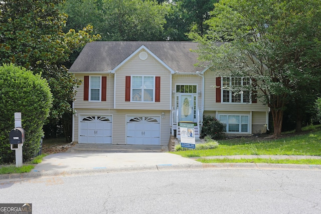 bi-level home featuring a garage