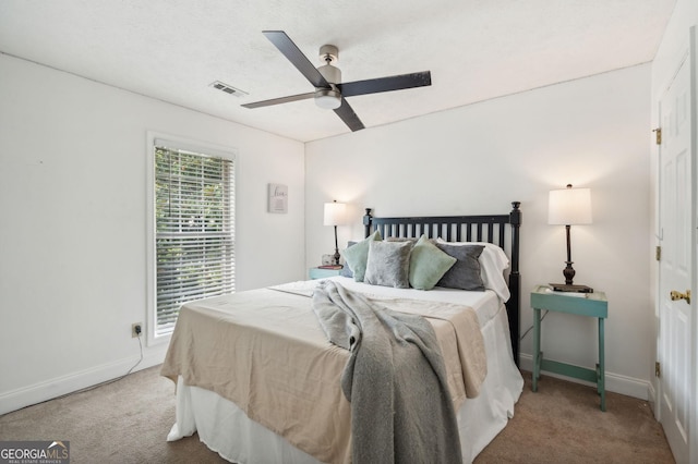 carpeted bedroom featuring ceiling fan