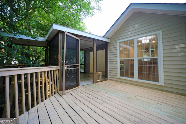 wooden terrace featuring a sunroom