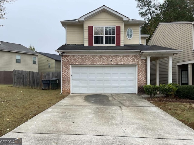 front facade with a garage and a front lawn