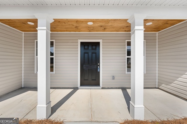 property entrance featuring covered porch