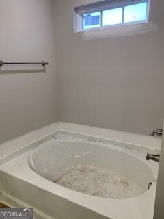 full bathroom with a bath